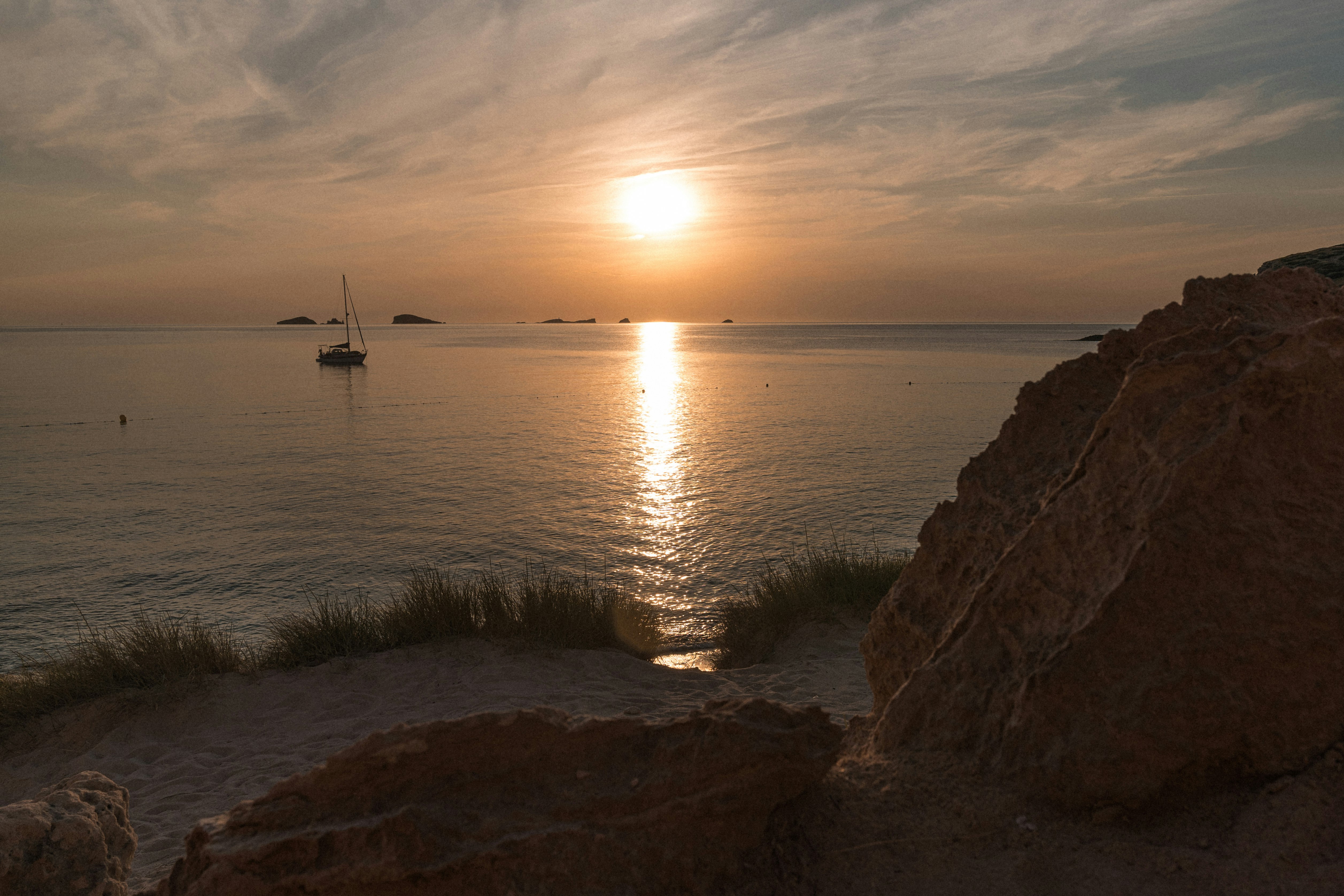 boat on sea during sunset